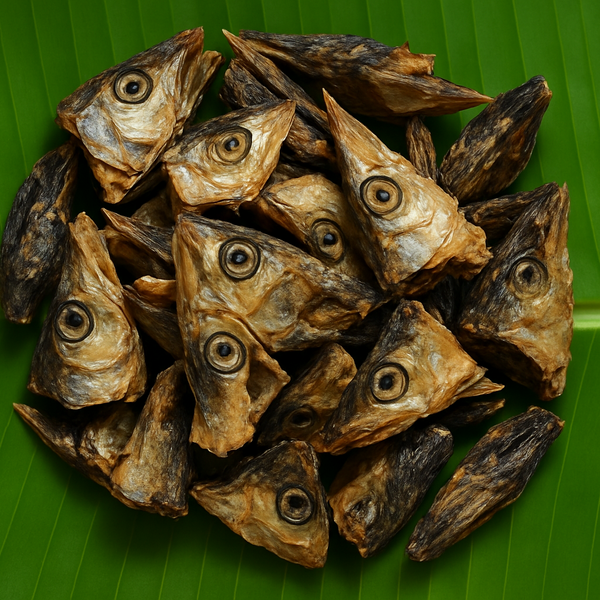 Professional product image of dried fish heads on banana leaf