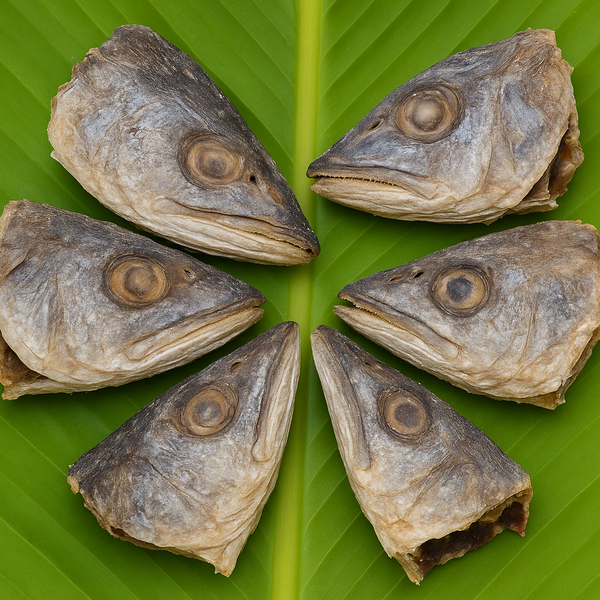 Professional product image of dried fish heads on banana leaf