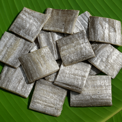 Professional product image of dried ribbon fish with silver shade on banana leaf