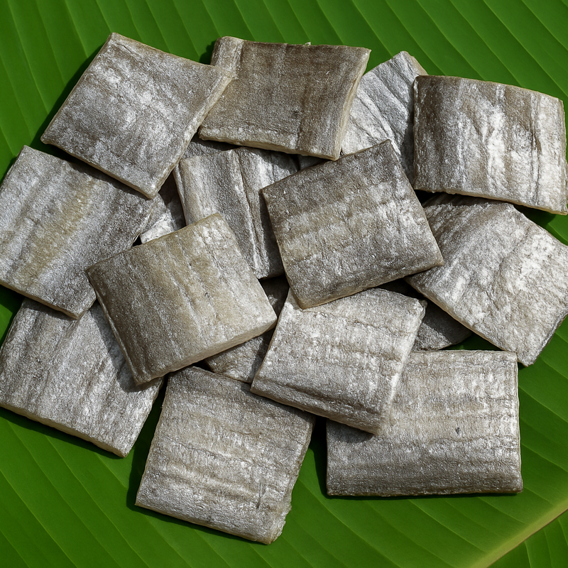 Professional product image of dried ribbon fish with silver shade on banana leaf