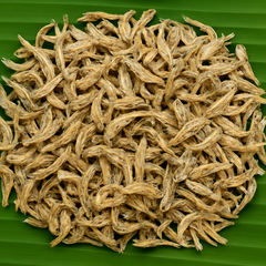 Professional product image of dried small fish on banana leaf