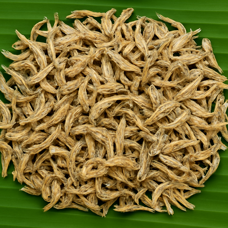 Professional product image of dried small fish on banana leaf