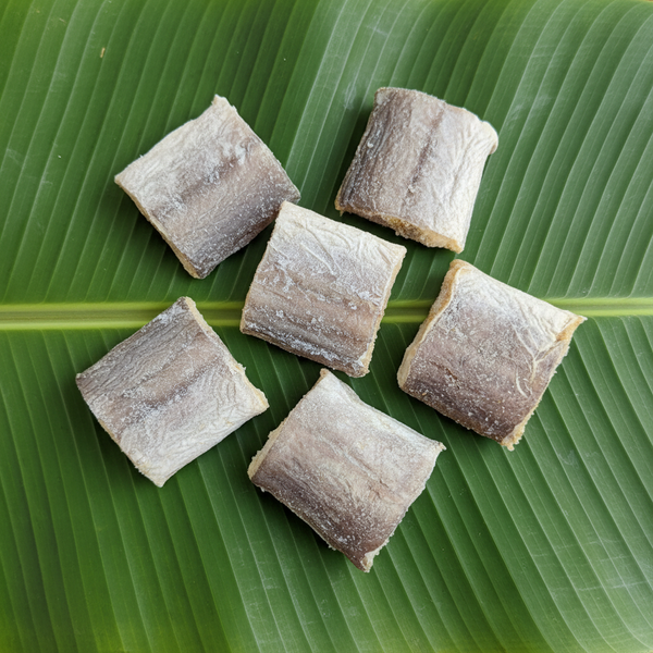 Dried fish pieces on banana leaf for Meta ads