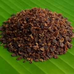 Generated dry tuna flakes with brown and black shades on banana leaf