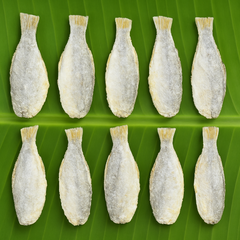 Professional product image of dried fish on banana leaf