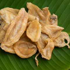 Professional product image of dried fish on banana leaf