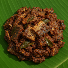 Ribbon Fish Thokku with dried ribbon fish pieces on banana leaf