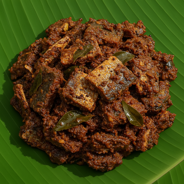 Ribbon Fish Thokku with dried ribbon fish pieces on banana leaf